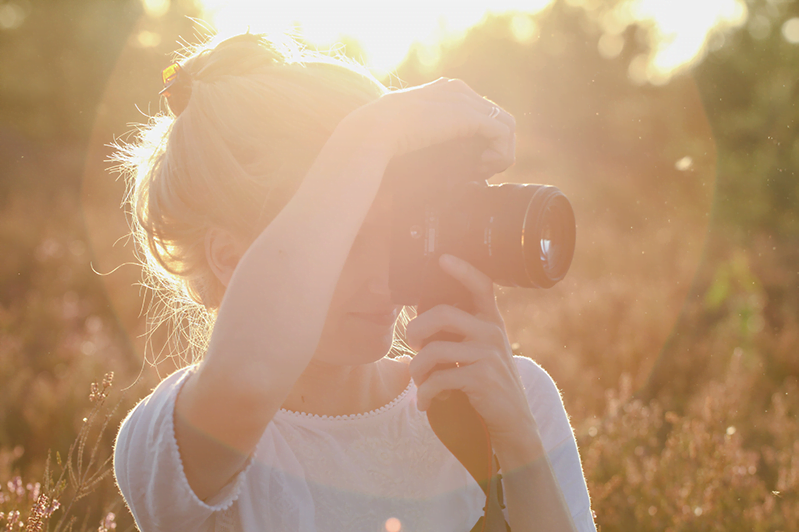 Women looking through viewfinder of dslr 